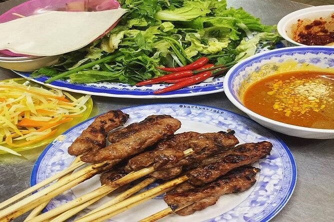 Da Nang Food Tour Motorbike & Sightseeing By Ao Dai Lady Rider - Love Bridge begins the city introduction