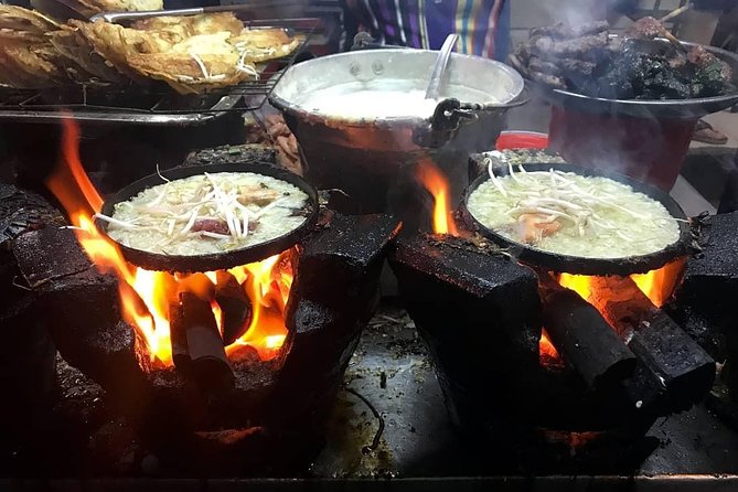 Experience Saigon Cuisine: Food Tour by Motorbike or Car - Riding through five districts on a motorbike