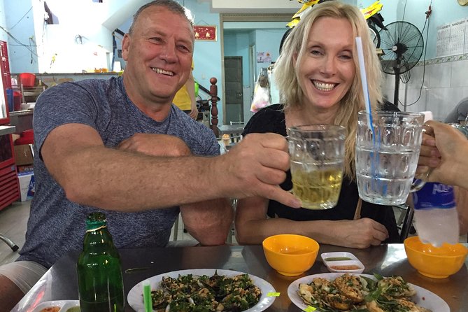 Experience Saigon Cuisine: Food Tour by Motorbike or Car - Crab soup, Vietnamese pizza, and other local stops