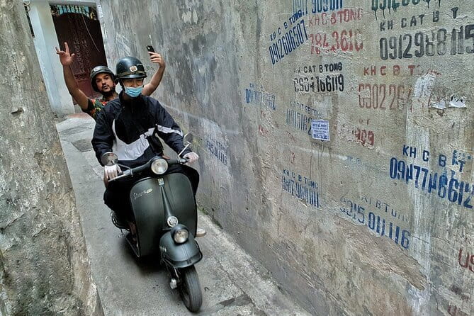 Hanoi Michelin Star Food Tour Via Jeep, Vespa or Motorbike - Riding an Army Jeep through evening traffic