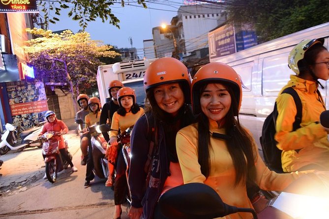 Hanoi Motorbike Tours Led By Women: Hanoi By Night Foodie Motorbike Tours - Long Biên Bridge and the northern side of the city