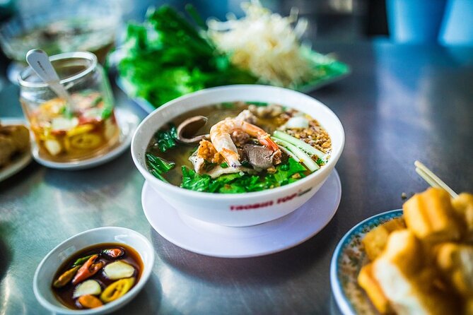 Hanoi Street Food Tour By Motorbike + Sightseeing SAFE & FUN - Steamed rice pancakes in Hanoi’s Old Town