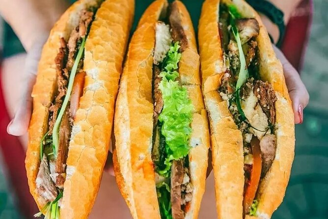 Ho Chi Minh City Street Food Tour & Sightseeing By Motorbike - Flowers, spring rolls, and the Ho Thi Ky Market
