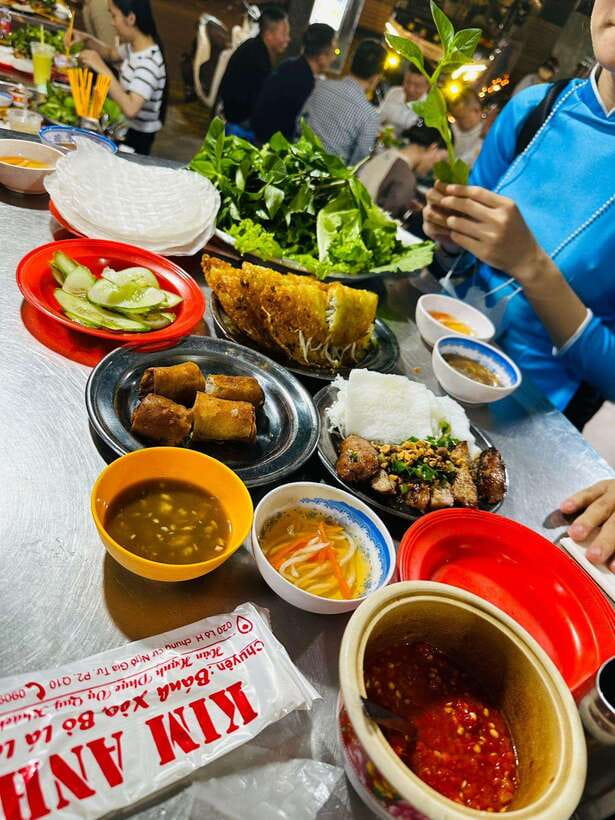 KISSTOUR | Motorbike Food Tour Female Drivers in Ho Chi Minh - Meeting your driver in a blue ao dai