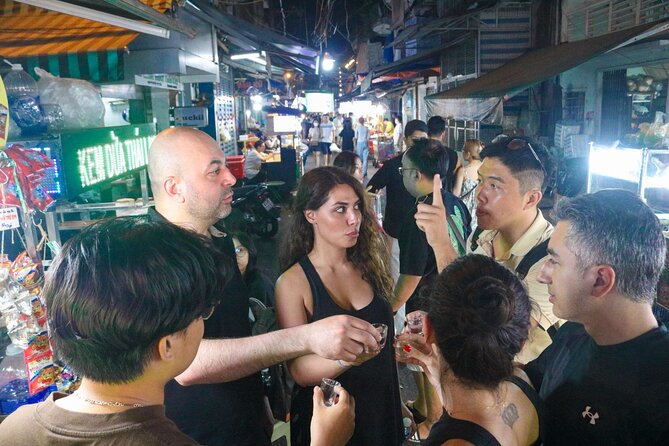 Private Discover Saigon Hidden Spots on Night Motorbike Adventure - A local snack, baguette, and beer in District 10