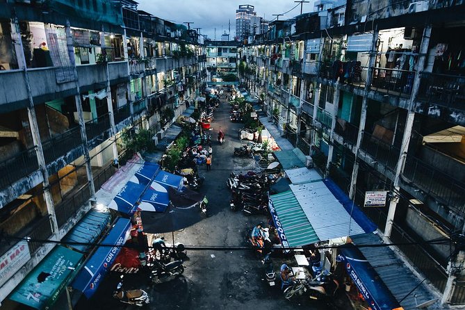 Private Hidden-Gem Sightseeing Motorbike Tour with Local Students - Old apartments and the city behind the main roads