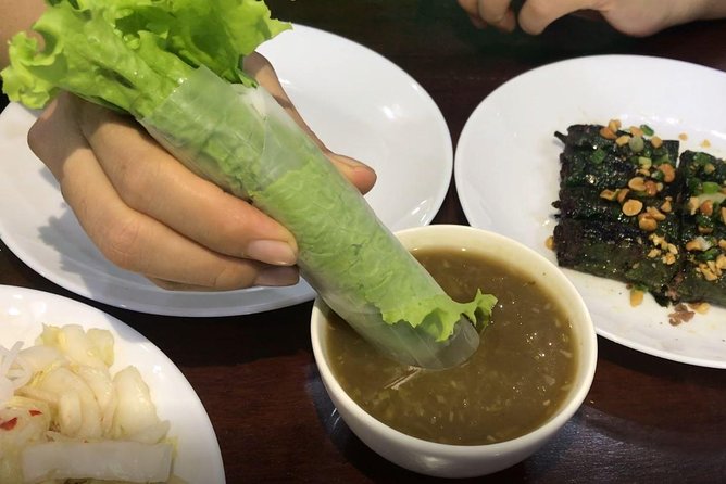 Private Ho Chi Minh Street Food Tour by Motorbike with Ao Dai Female Rider - Xom Chieu, Vinh Khanh, and the seafood challenge