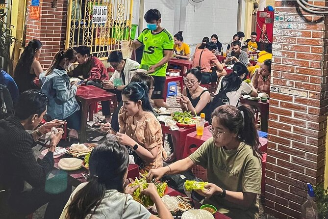 Private Street Food Tour by Motorbike/Car with Local Students - Tasting 3: banh mi at a traditional vendor