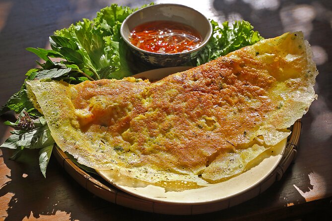 Saigon By Night and Vietnam Local Food on Motorbike - City lights and District 2 finish the ride