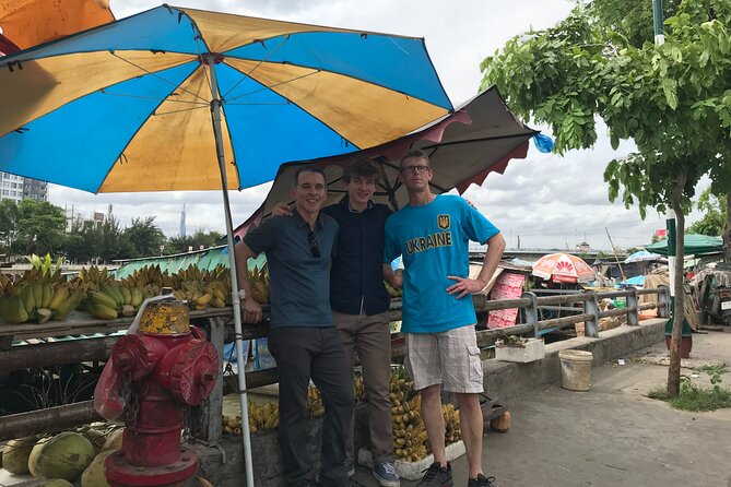 Saigon Slum tour and Saigon Chillspots by motorbike/ Aodai rider - Riding beyond central Ho Chi Minh City