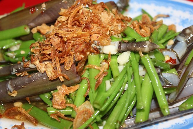 Saigon Street Food & Hidden Gems Tour: Live Like a Local - Riding through Saigon’s seven million motorbikes