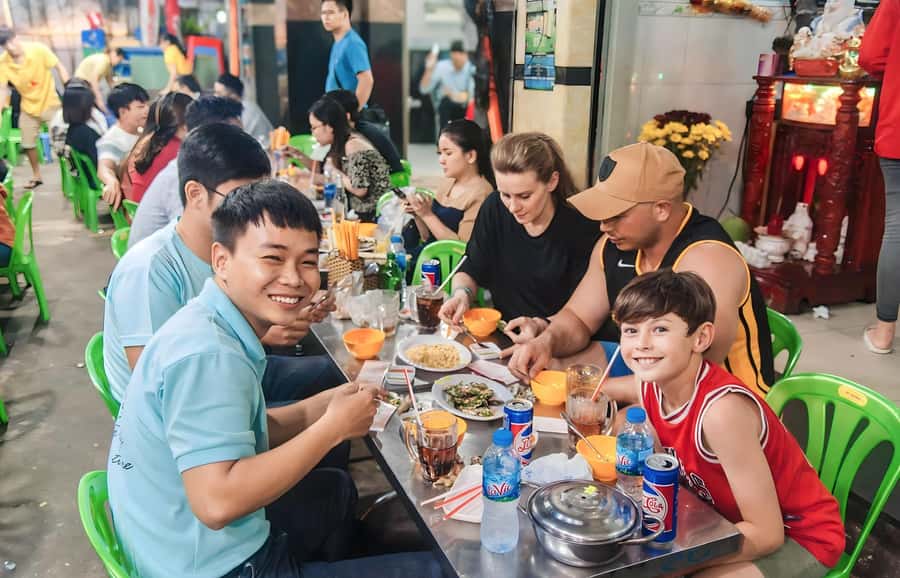 Saigon: Street Food Tasting & Sightseeing Tour by Motorbike - District 10 and grilled banana with coconut