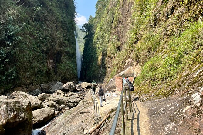 Sapa Motorbike Tour to Dragon Waterfall and Hidden Village - Muong Hum, a market beside the river